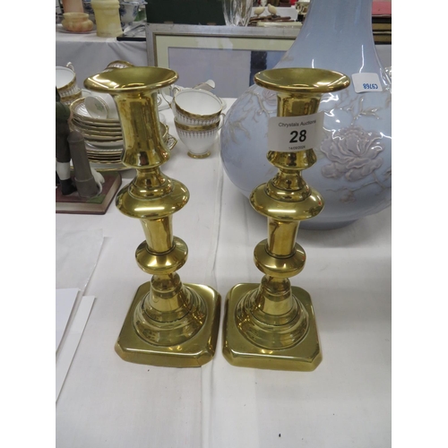 28 - A pair of 18thC brass candle sticks