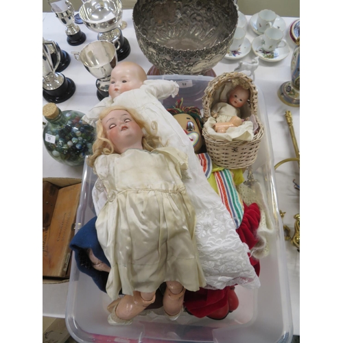 52 - A collection of early 20thC and later porcelain headed and other dolls