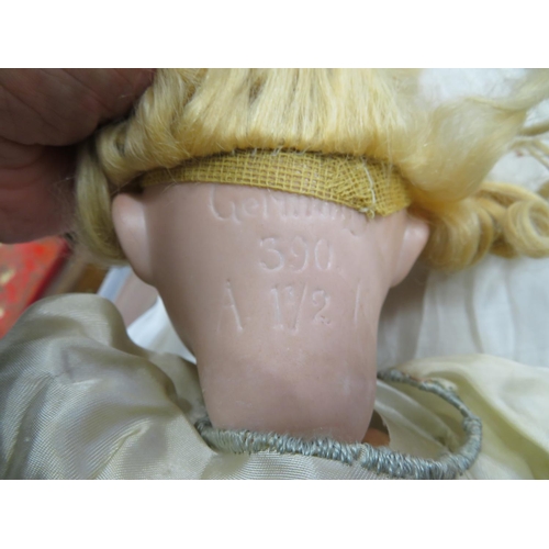 52 - A collection of early 20thC and later porcelain headed and other dolls