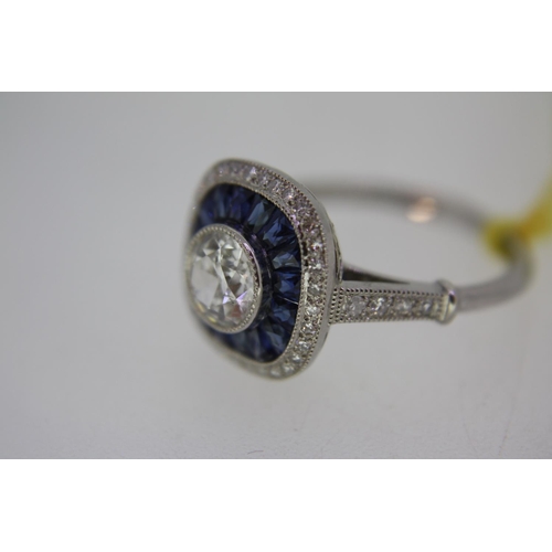 197 - Sapphire and diamond ring with central diamond surrounded by sapphires and diamonds with diamond sho... 