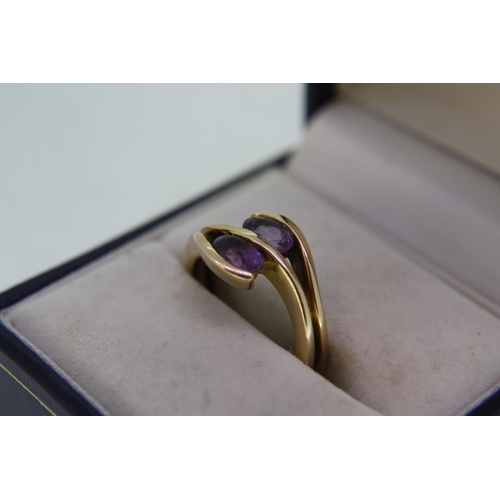 200 - 9 ct. rose gold amethyst twist ring , size M/N