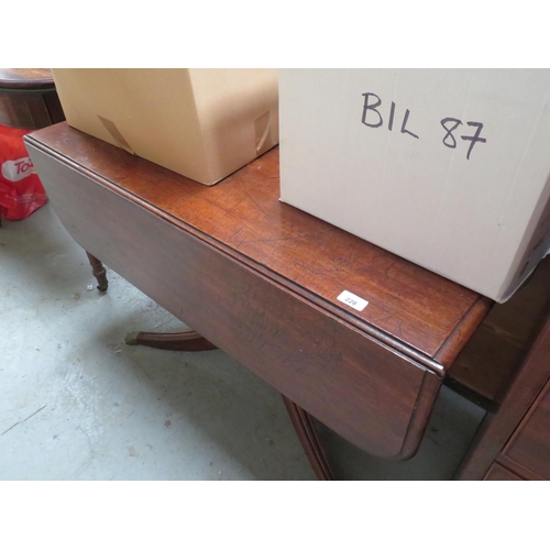 228 - Mahogany sofa table on quadrafoil base with lion paw feet and castors