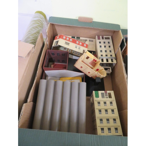 251 - Four boxes of OO-gauge train buildings, track etc