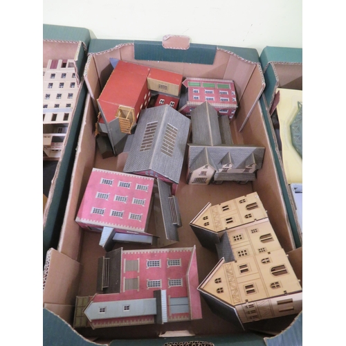 251 - Four boxes of OO-gauge train buildings, track etc