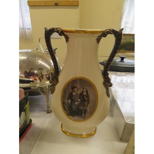 417 - Porcelain two handled vase with a portrait of children to front - ht. 13 ins