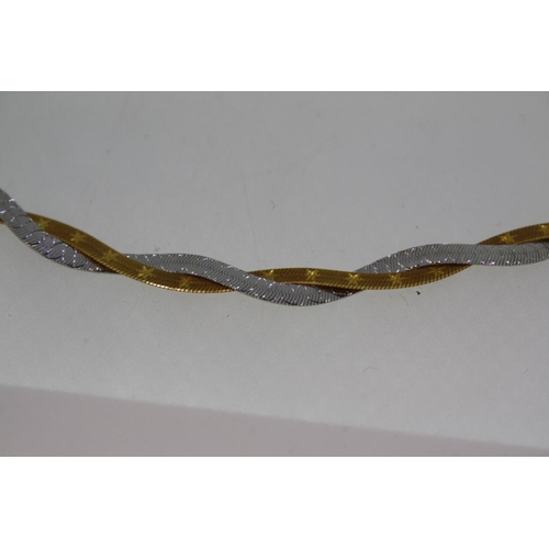 379 - 9ct two colour gold twist necklace, 8.5grams