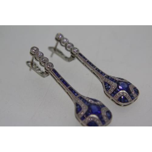 441 - Pair of platinum sapphire and diamond long drop earrings in the Art Deco style