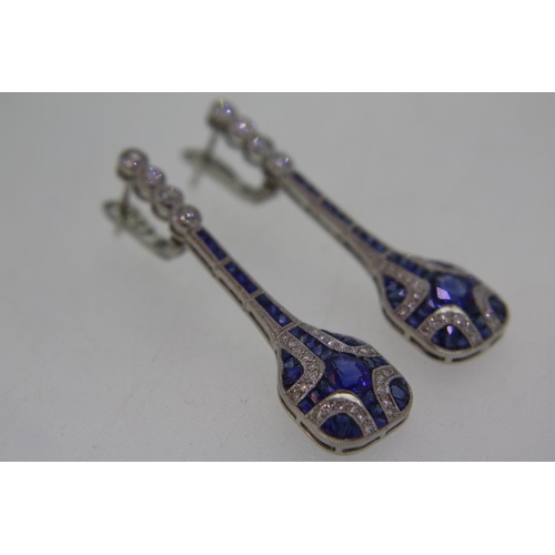 441 - Pair of platinum sapphire and diamond long drop earrings in the Art Deco style