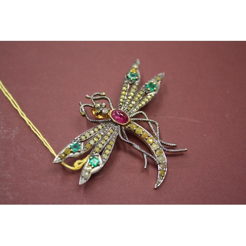 457 - Large silver gilt dragonfly brooch set with cabochon ruby, emeralds and yellow diamonds, 2ins across... 