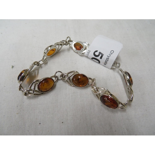 500 - Silver and amber bracelet with Celtic decoration