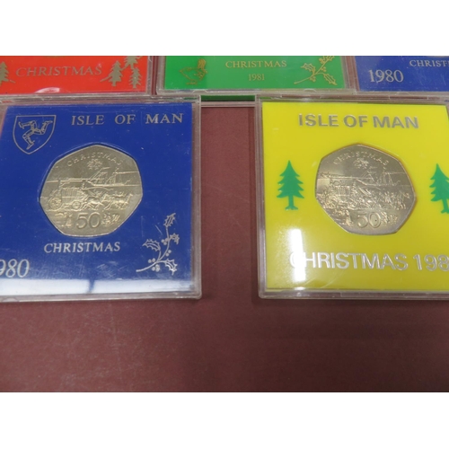 526 - Twelve cased Isle of Man Christmas 50p coins