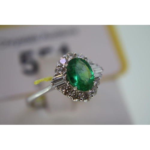 551 - 18ct white gold ring set with oval emerald and baguette cut diamonds, size P