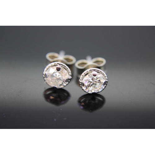 555 - Pair of diamond earstuds set in 9ct white gold, total diamonds 1ct approx