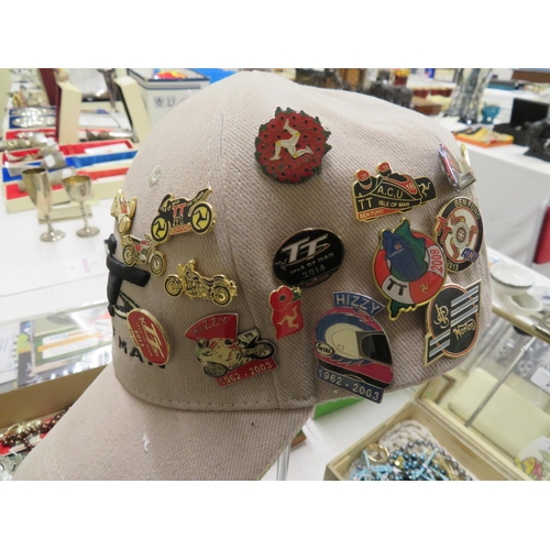 4 - Isle of Man TT cap containing many motorcycle badges