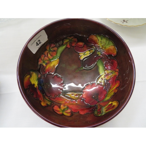 42 - Moorcroft Orchid pattern bowl on a brown ground, 5.5ins diameter