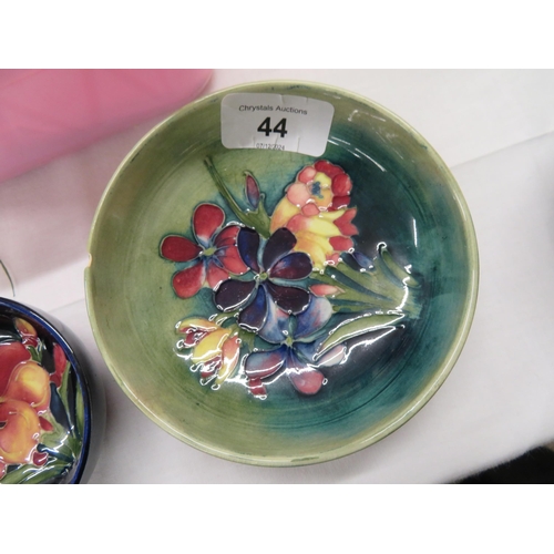 44 - Two Moorcroft bowls with floral decoration, green ground and blue ground