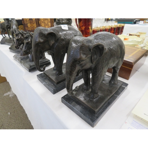 129 - Pair of brown patinated bronze Indian elephants on black marble bases - ht. 8 ins