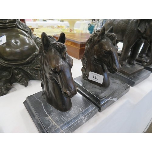 130 - A pair of brown patinated bronze horse heads on black marble bases - ht. 5.5 ins