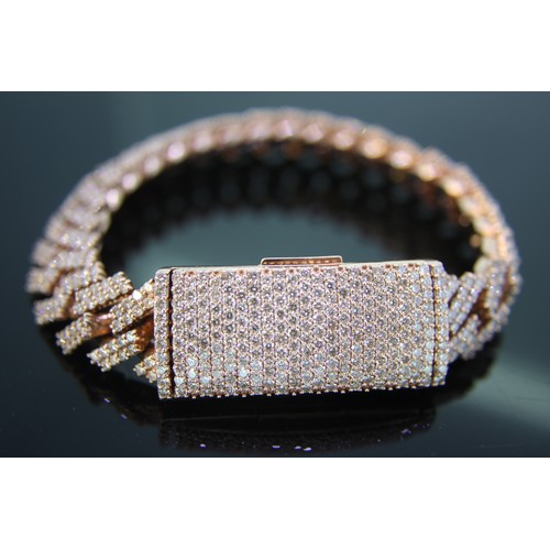 239 - 10 ct. rose gold bracelet set with numerous diamonds