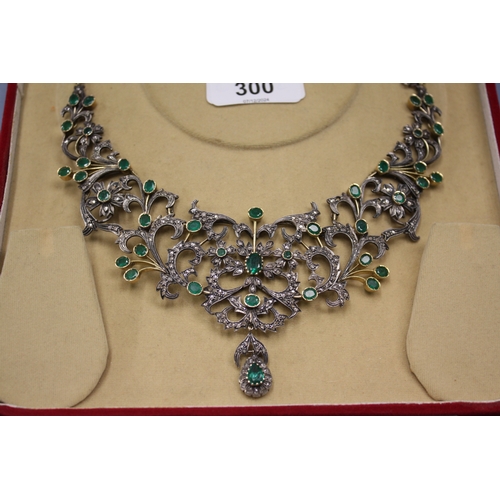 300 - An impressive emerald and diamond necklace set in silver