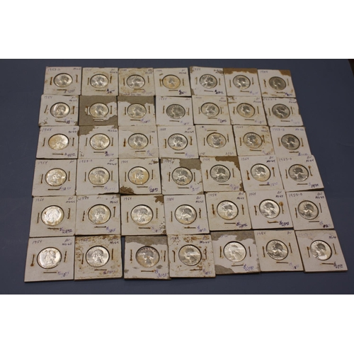 214 - Approx 80 silver half dollars (carded 90% silver)