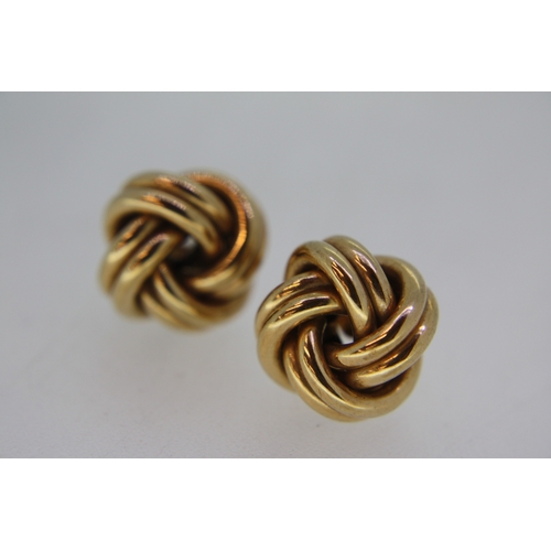 215 - Pair of 9 ct. gold knot earrings