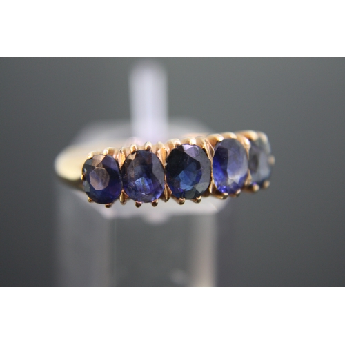 204 - Gold and sapphire ring, size O