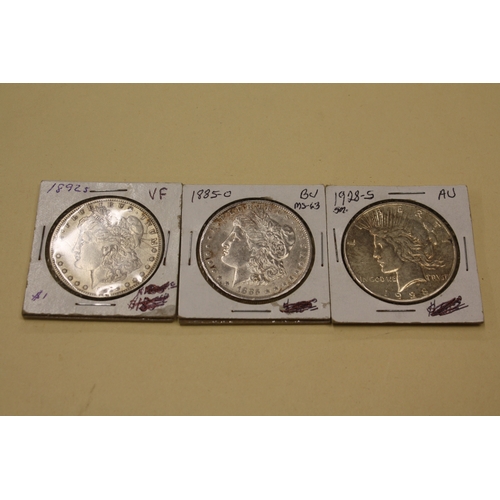 213 - Three American silver dollars, 1) Liberty 1928, 2) Morgan 1885, 3) Morgan 1892