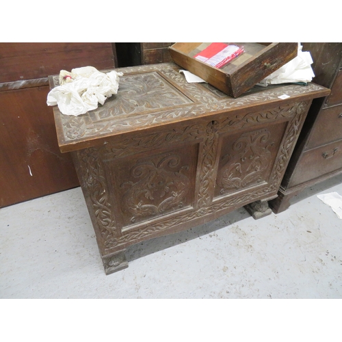 327 - Late 19thC well carved oak coffer with decoration of dolphins to panel front on carved block feet, w... 