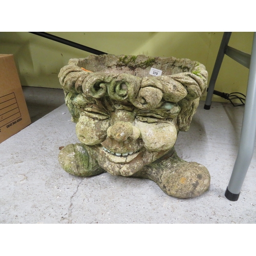 370 - Concrete garden pot head with grinning face to front