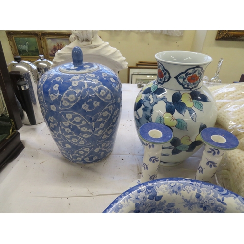 229 - A collection of blue and white vases, bowls, ornaments, candle sticks