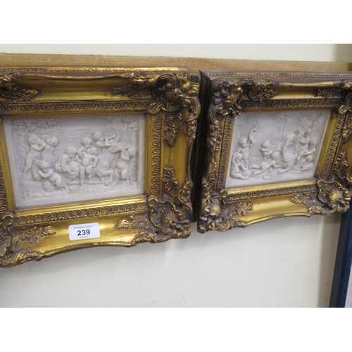 239 - Pair of gilt frame carved pictures of Putti attacking animals