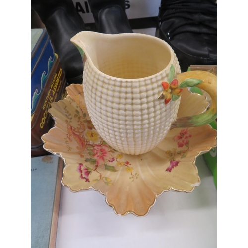 16 - A shell shaped Carlton ware bowl and a jug