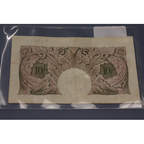 104 - A Bank of England purple 10/- note in good condition - Peppiatt