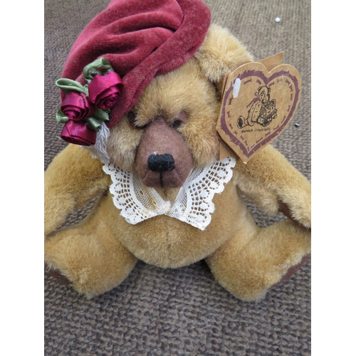 7 - A Judy Senk Teddy Bear with striped tunic and straw hat - length 10 ins approx. plus Paddington and ... 