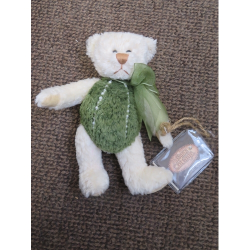 7 - A Judy Senk Teddy Bear with striped tunic and straw hat - length 10 ins approx. plus Paddington and ... 