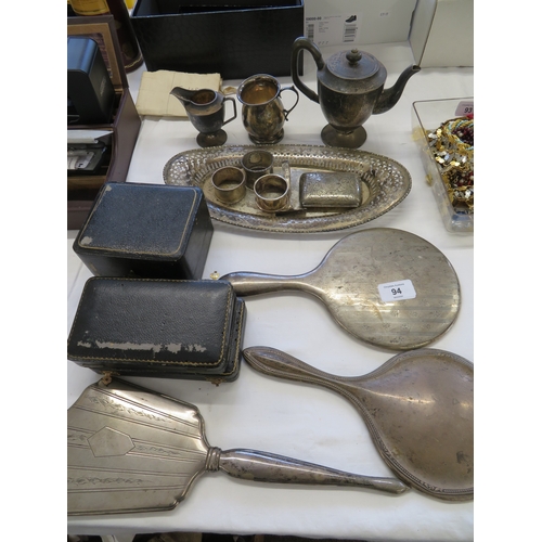 94 - A collection of silver items including breakfast coffee pot, oval tray, napkin rings, cigarette case... 