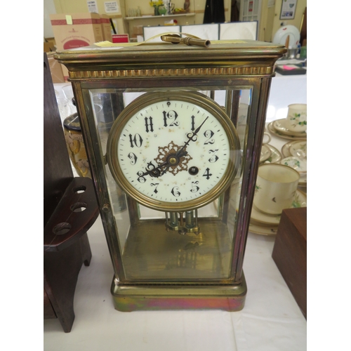 10 - 19thC four glass brass table clock with mercury pendulum, striking on a gong, height 12ins