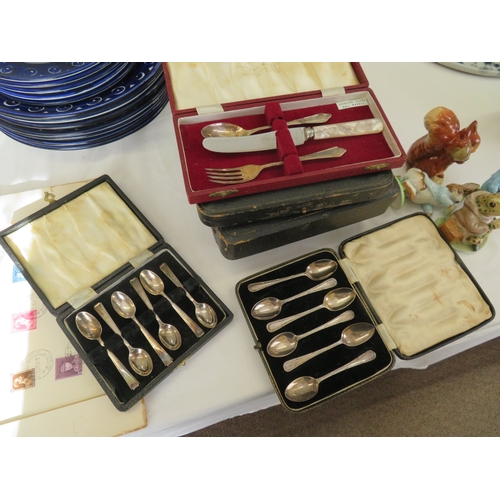 23 - Four cased silver spoons, christening set, butter knives plus two epns sets