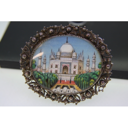 34 - Indian silver coloured metal oval brooch showing the Taj Mahal