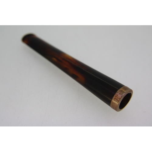 38 - Amber style cigarette holder with gold collar, cased