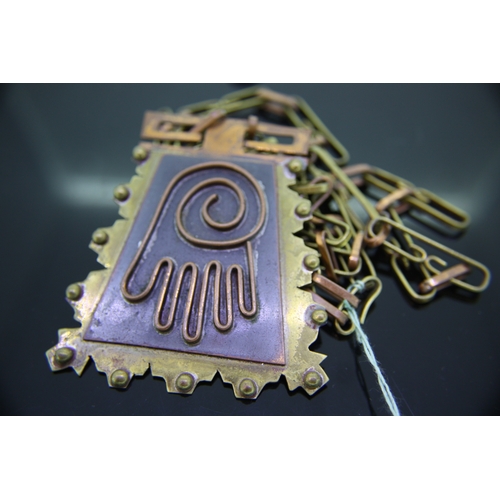 42 - Unusual brass and copper 1970s pendant necklace with hand design