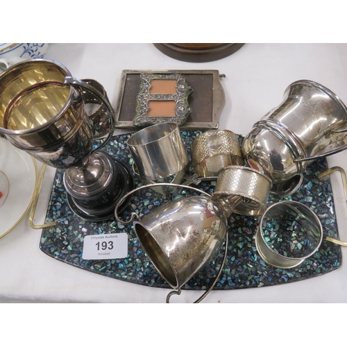 193 - A collection of odd silver napkin rings, trophies, photograph frames, 11 ozt weighable