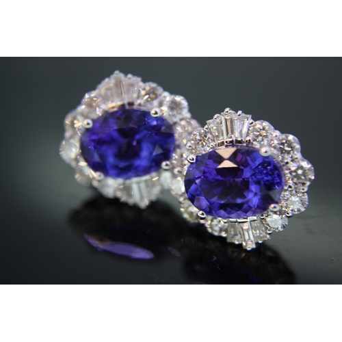 225 - 18 ct gold oval tanzanite diamond cluster earrings - tanzanites 7.5 cts approx