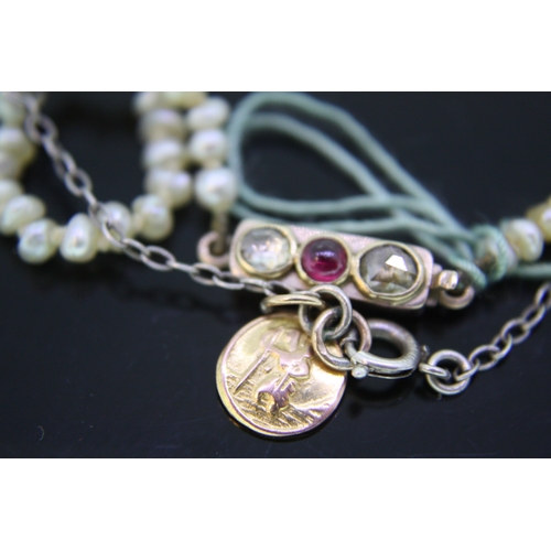 264 - Misshapen pearl necklace with gold ruby and diamond clasp