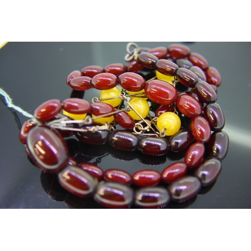 266 - Amber and amber type beads