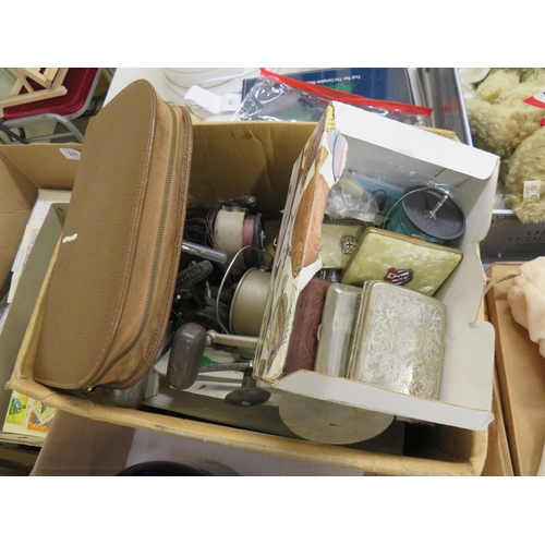 283 - Box containing fishing reels, cigarette cases, crown green bowls and a toilet case