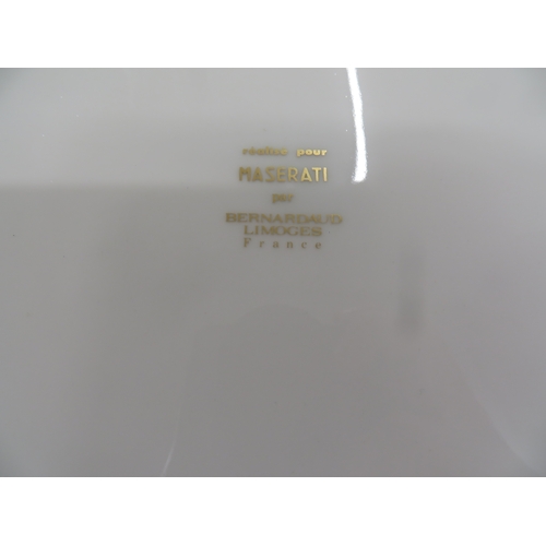 41 - Set of Six Bernardaud Limoges Maserati dishes - with gilt and navy blue borders - bearing the Masera... 