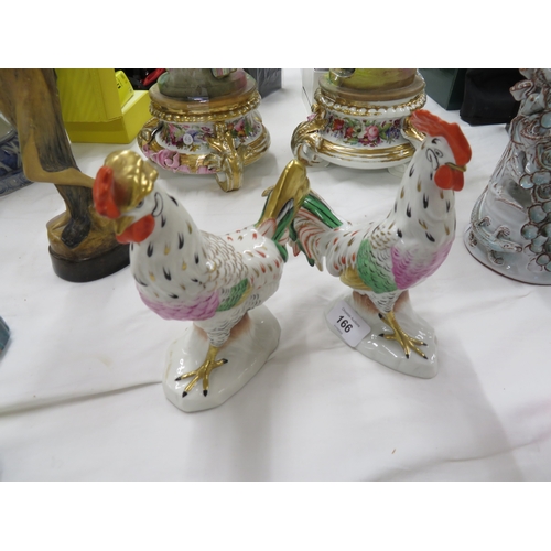 166 - Pair of Continental porcelain cock and hen figures with gold anchor mark to back - ht. 6 ins