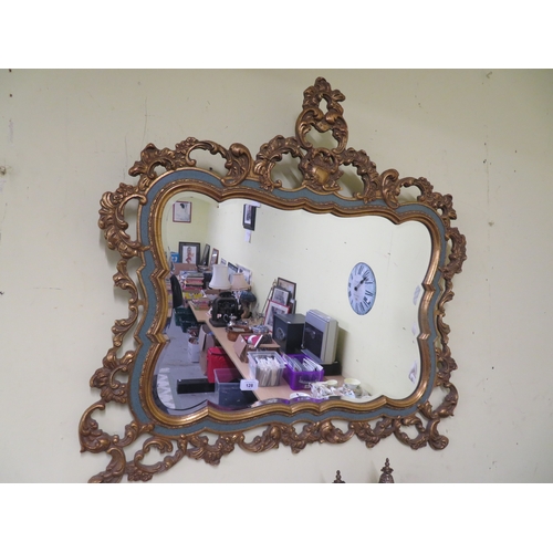 128 - Ornate gilt framed bevel edged glass wall mirror
